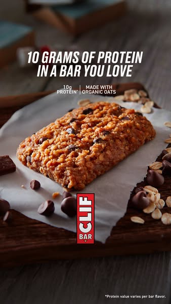 This ad for Clif Bar features a close up image of a Chocolate Chip flavored Clif Bar on a wooden background. The ad high