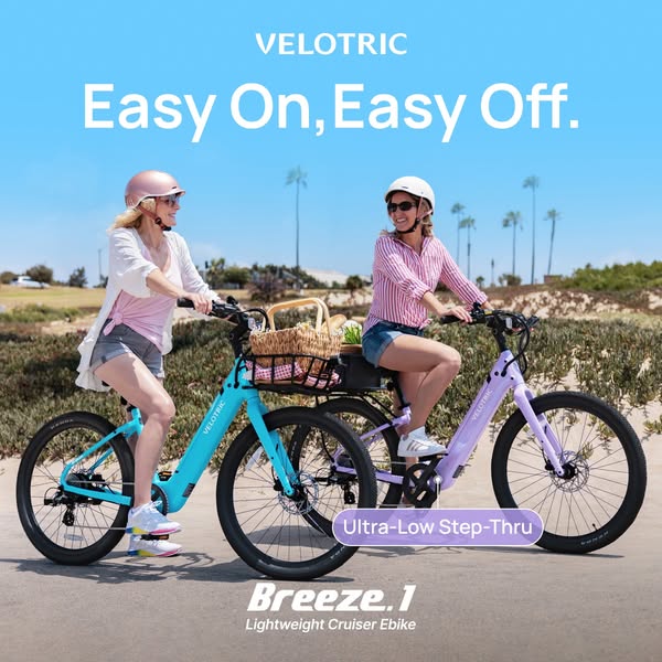 This ad features two women riding Velotric Breeze.1 e-bikes on a sunny day near the beach. The focus is on the e-bike