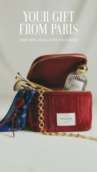 This ad promotes a gift with purchase from Sézane. The ad features a red velvet makeup bag with a gold chain strap, a pe