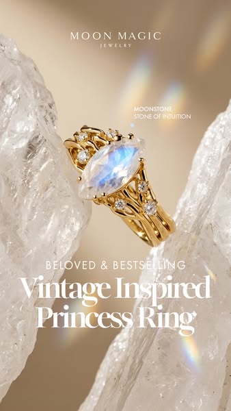 Close-up of gold ring with a moonstone that has a vintage-inspired design.