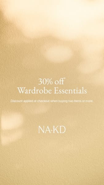 This image ad from NA-KD promotes 30% off wardrobe essentials when buying two or more items. The ad features a simple ba