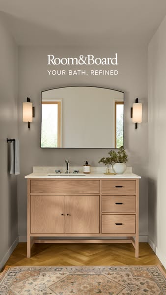 This ad features a bathroom vanity from Room & Board. The overall visual style is clean and minimalist, and the ad p