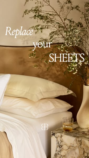 This image ad encourages viewers to replace their bed sheets. The image focuses on a close-up view of a bed with layered