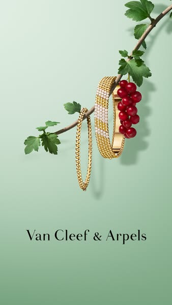 This ad for Van Cleef & Arpels features fine jewelry from the brand's Perlée collection artfully displayed on a 