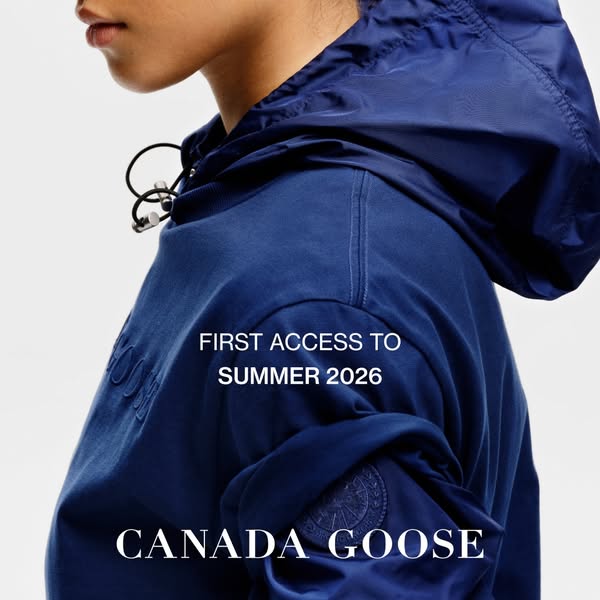 This image ad for Canada Goose features a close-up of a navy blue jacket from their Summer 2026 collection. The ad aims 