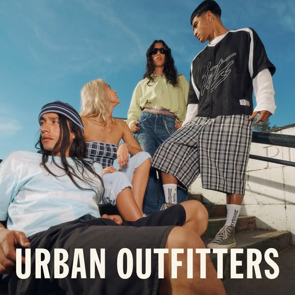 This ad for Urban Outfitters features five young adults in trendy outfits standing on a set of stairs outside. The cloth