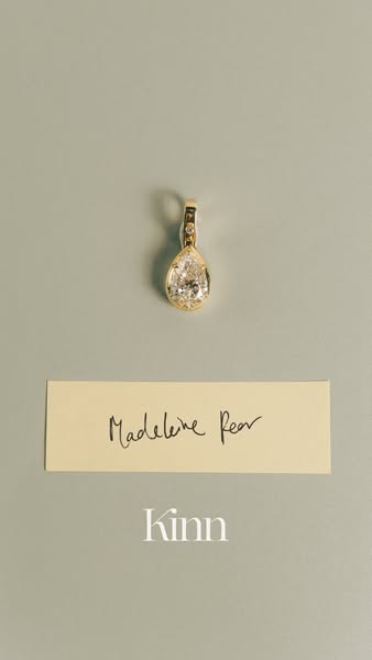 This ad showcases the Kinn brand's Madeleine Pear pendant. The ad features a minimalist aesthetic with the pendant p