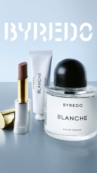 This is an image ad from Byredo featuring their lipstick, hand cream, and Blanche eau de parfum products.