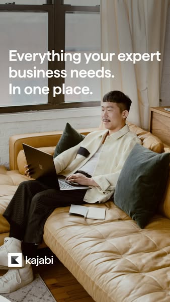 An image ad for Kajabi, featuring a person sitting on a couch using a laptop. The ad promotes Kajabi as a platform that 
