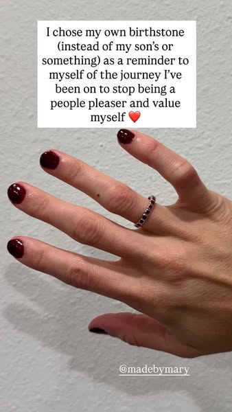 An image ad featuring a hand with a ring on the ring finger, next to a square of text about choosing a birthstone.