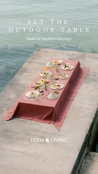 This ad features an outdoor dining set up on a concrete dock with the ocean in the background. The image is clean and br