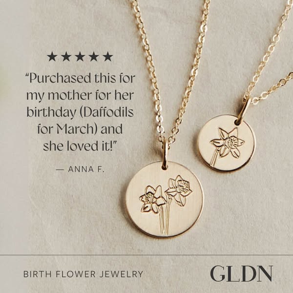 This ad features GLDN birth flower jewelry. It showcases two gold necklaces with circular pendants engraved with daffodi