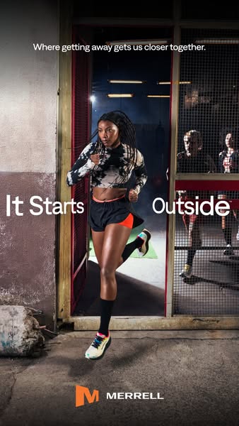 This ad shows a woman running through an open doorway, framed by urban surroundings and people working out inside a buil