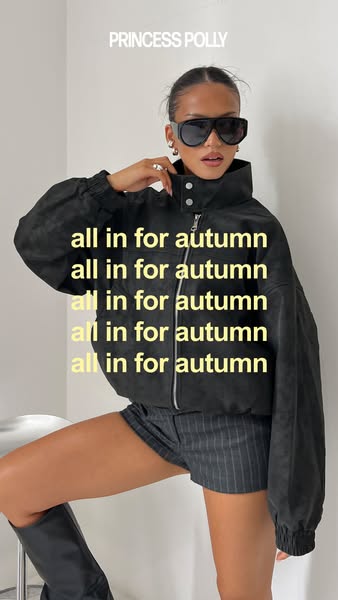 An image ad showcasing a black jacket paired with shorts and knee-high boots. The ad repeats the phrase 'all in for 