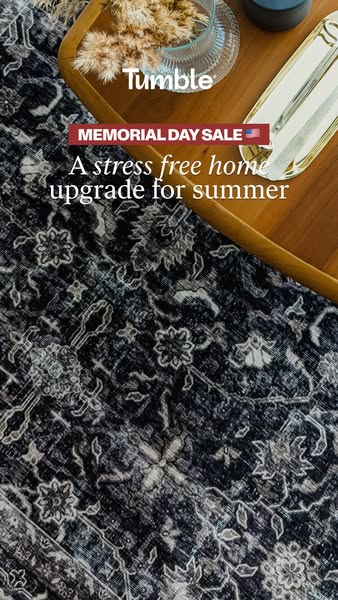 This ad for Tumble rugs promotes a Memorial Day sale with a visual of one of their rugs and props on a table.