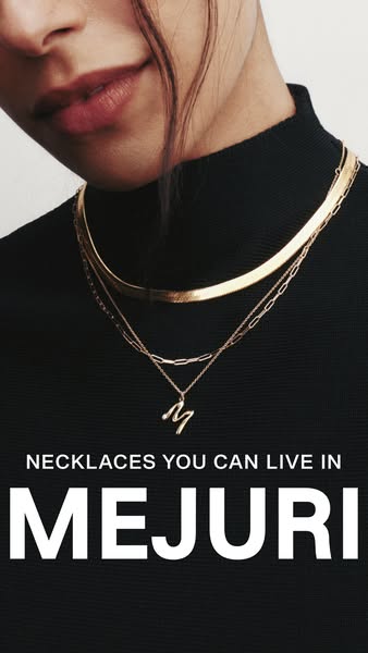 An image ad for Mejuri necklaces shows a close up of a person wearing three Mejuri gold necklaces layered together. The 