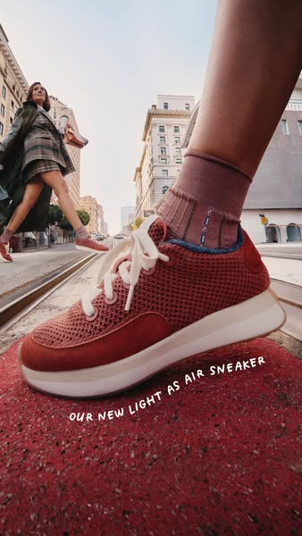This ad showcases Allbirds' new light as air sneaker in an urban setting.