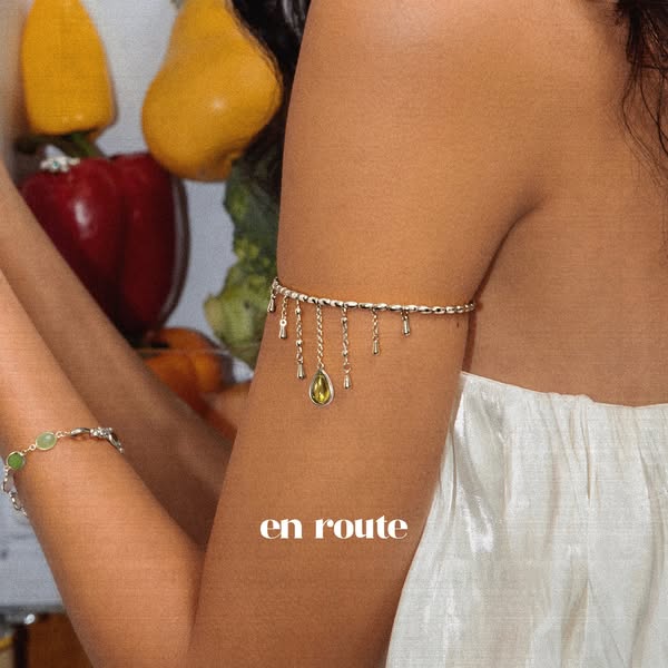 This ad showcases the brand's jewelry by featuring a woman with an upper arm bracelet, highlighting the design and s