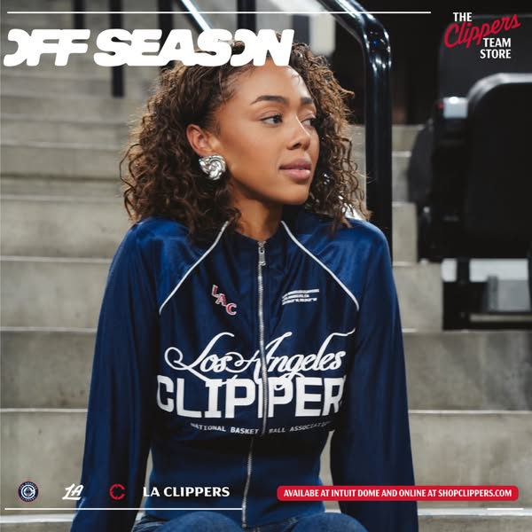 This ad for the Clippers Team Store features a woman wearing a Clippers jacket while sitting on stadium steps. The ad pr