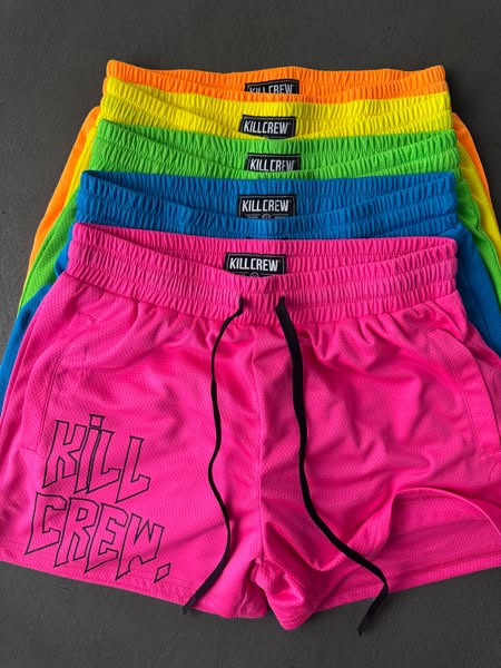 This image ad showcases a stack of mesh shorts from Kill Crew. The shorts are shown in a variety of colors.