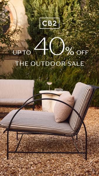 An image ad showcasing outdoor furniture from CB2, highlighting a sale with up to 40% off. The ad features a stylish out