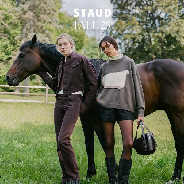 This ad showcases Staud's Fall 2025 collection, featuring two models in an outdoor setting with a horse. The ad emph
