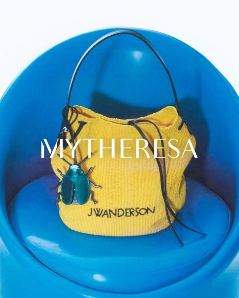 This ad is showcasing a yellow J.W. Anderson bag sold at MyTheresa, placed in a blue chair.