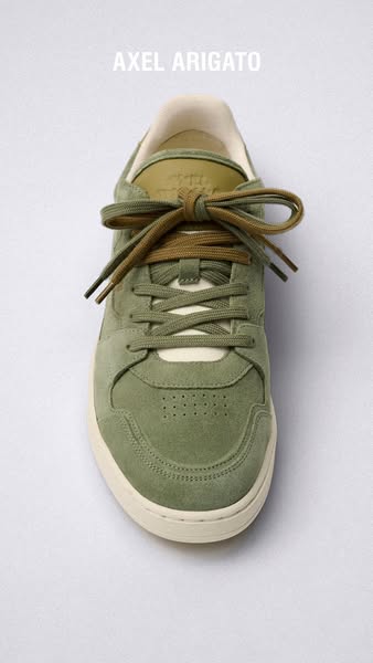 A straightforward product shot of a green Axel Arigato sneaker.