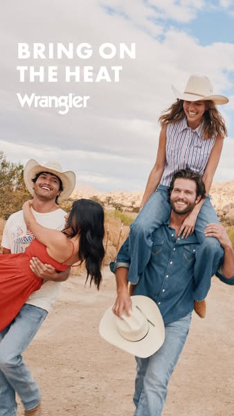 The image shows a group of 4 people, 2 women and 2 men, wearing Wrangler clothing. They are outside on a dirt road with 