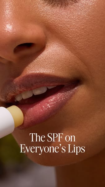 This ad features a close up shot of a woman applying SPF lip balm and features the tagline, "The SPF on Everyone