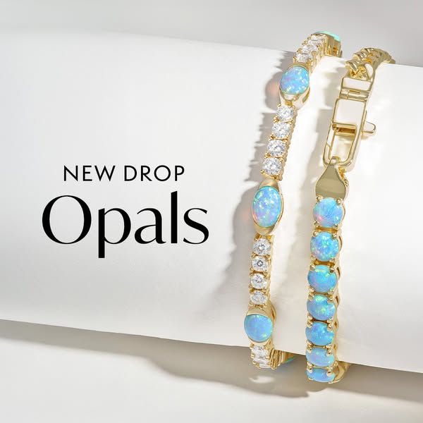This ad showcases two gold bracelets with opals and diamonds, announcing a new arrival of opal jewelry.