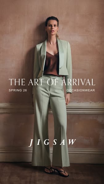 This ad promotes Jigsaw's new spring occasionwear line. It showcases a woman modeling a matching light green blazer 