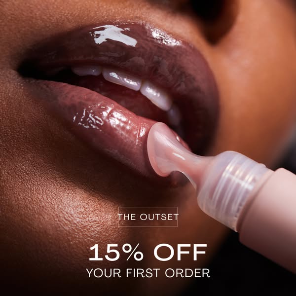 This ad for The Outset features a close up view of a woman applying a lip treatment. The ad promotes 15% off the first o