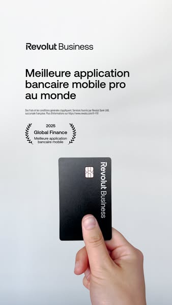 This ad promotes Revolut Business and states that it is the best mobile banking app in the world. It features a hand hol