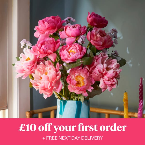 An image promoting a flower delivery service, showcasing a bouquet of pink flowers in a light blue vase, with a discount
