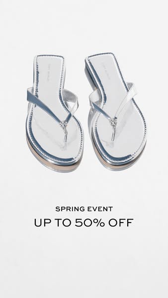 This image ad showcases a pair of shiny, silver flip-flops and promotes a spring sale event with up to 50% off.