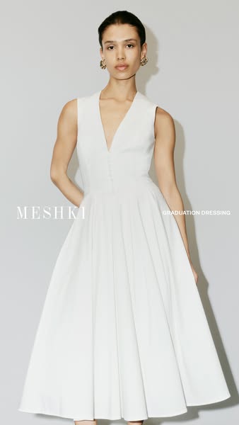 The ad features an image of a woman wearing a white dress, with the brand name 'MESHKI' and the words 'GRADU