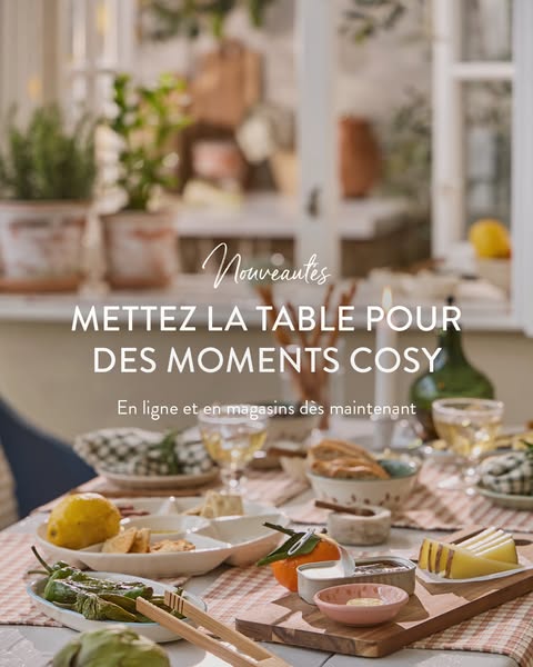This ad features an image of a table set with various serving dishes, food, and drinks, promoting a cozy and inviting at