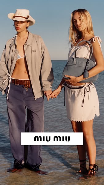 This ad features two models standing on a beach with the brand name overlayed across their legs.