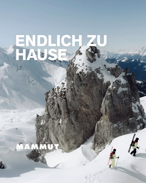 This image ad for Mammut features a scenic mountain landscape with two skiers hiking up a snowy slope. The ad emphasizes