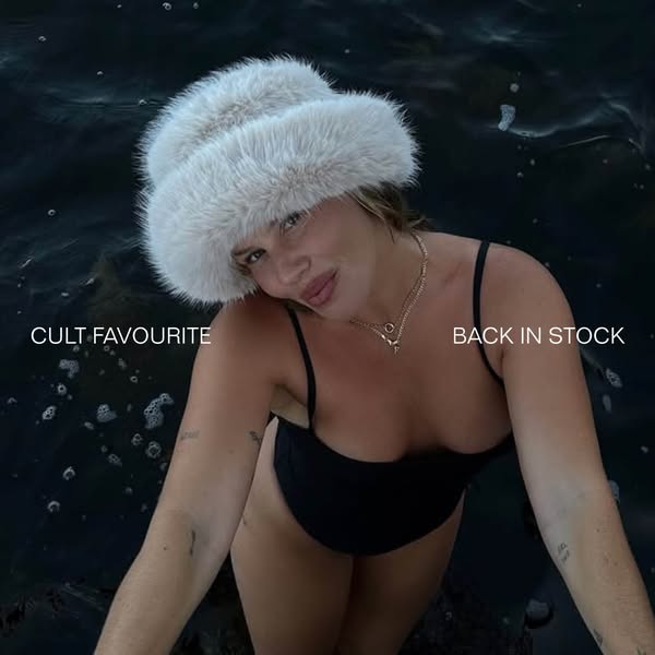 The ad showcases a person in water wearing a fur hat and a black bathing suit. The ad indicates that the advertised hat