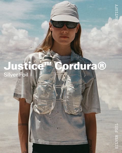 This ad features a person wearing the Satisfy Justice™ Cordura® running hydration vest in Silver Foil, highlighting its 