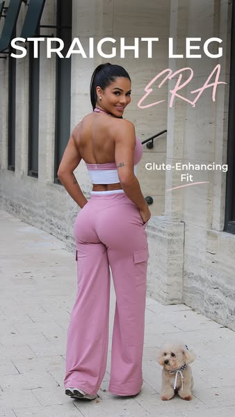 This ad showcases the glute-enhancing fit and straight leg style of a pair of pink pants and matching halter top worn by