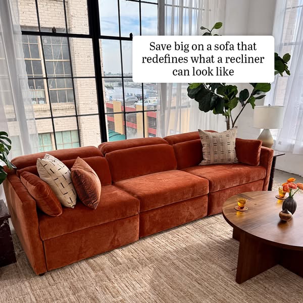 The ad showcases a modular recliner sofa in a modern living space with a large window and stylish decor. The messaging f