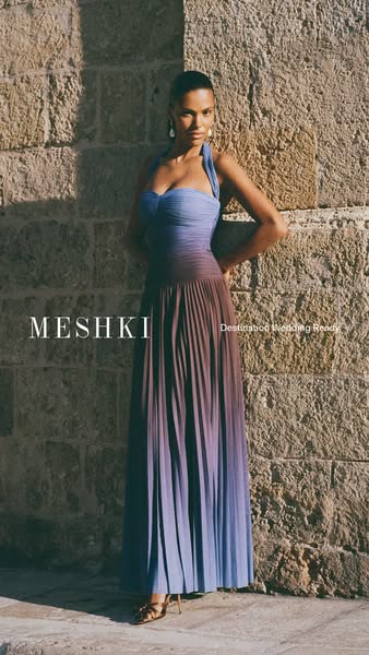 An ad for Meshki featuring a model wearing a long blue and purple gradient gown. The text overlay reads "Destinatio