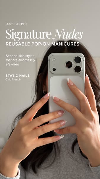 This ad from Static Nails promotes their signature nude, reusable pop-on manicures. It features a woman holding up her p