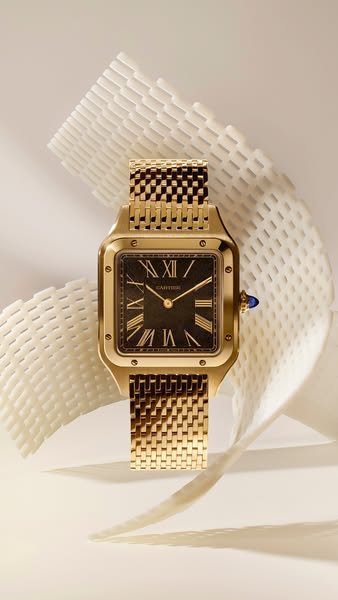 This image ad showcases a gold Cartier Santos watch against a minimalistic background. The watch is prominently displaye