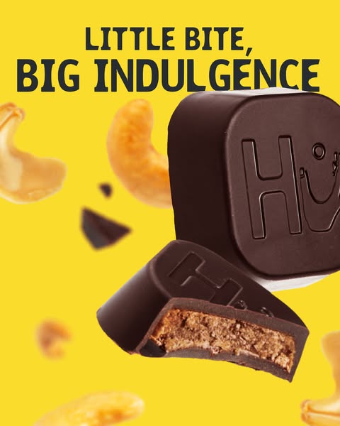 An image ad for Hu chocolate-covered cashew butter squares. The ad shows two squares in a bright, graphic layout designe