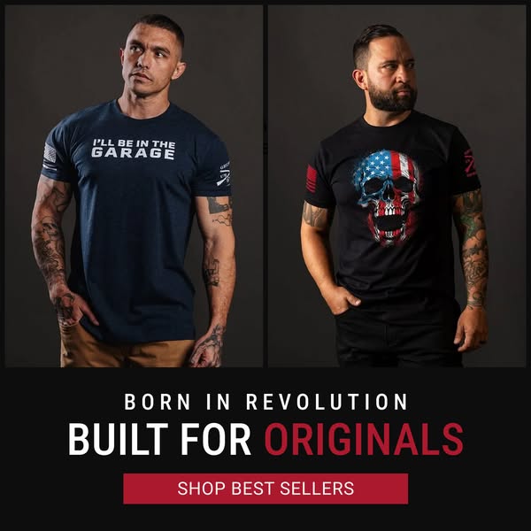 The ad features two men wearing t-shirts from Grunt Style. The shirts each feature a different design. The ad encourages