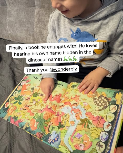 A young child is shown pointing at a Wonderbly dinosaur book. The testimonial shares that the child loves hearing his ow